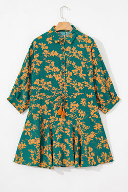 Short fluid dress tunic with green floral print tightening