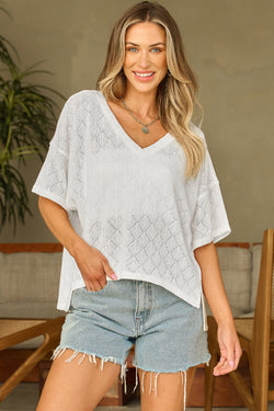 Fluid white knitted blouse with v -neck collar