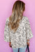 Beige blouse with round neck and abstract print balloon sleeves