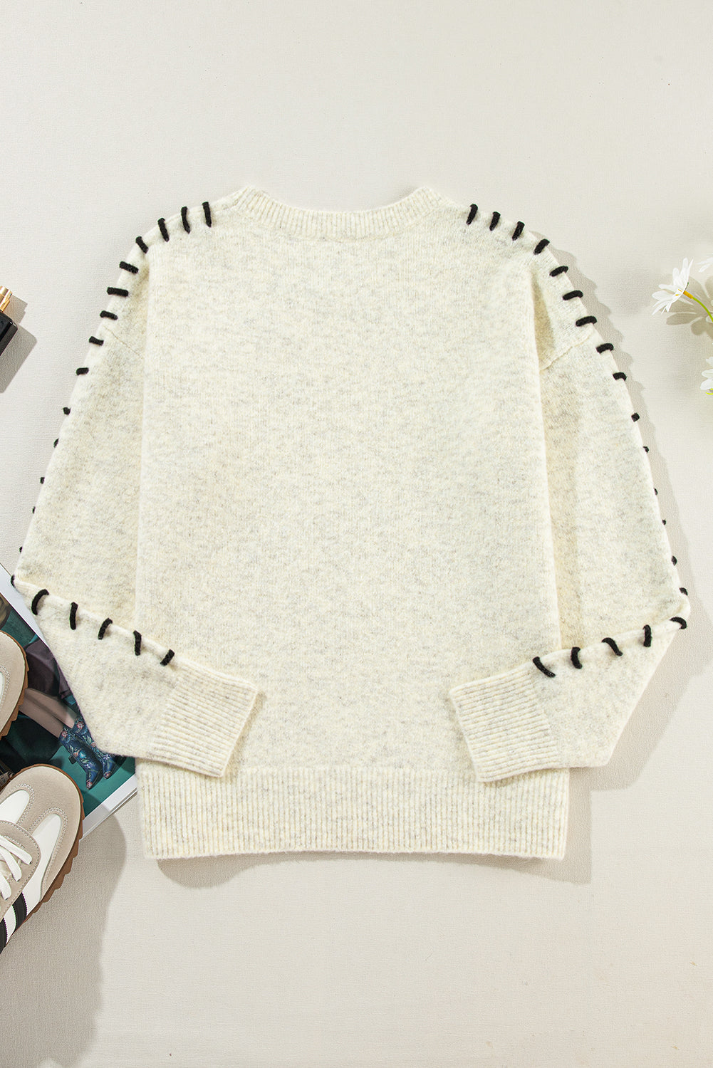 White ribbed sweater with contrast stitching