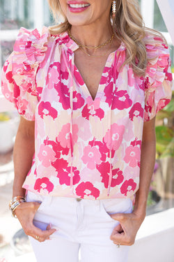 Pink flower high with split neck and puffy sleeves with ruffles