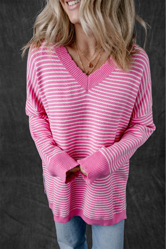 Loose V-neck sweater with pink striped slits