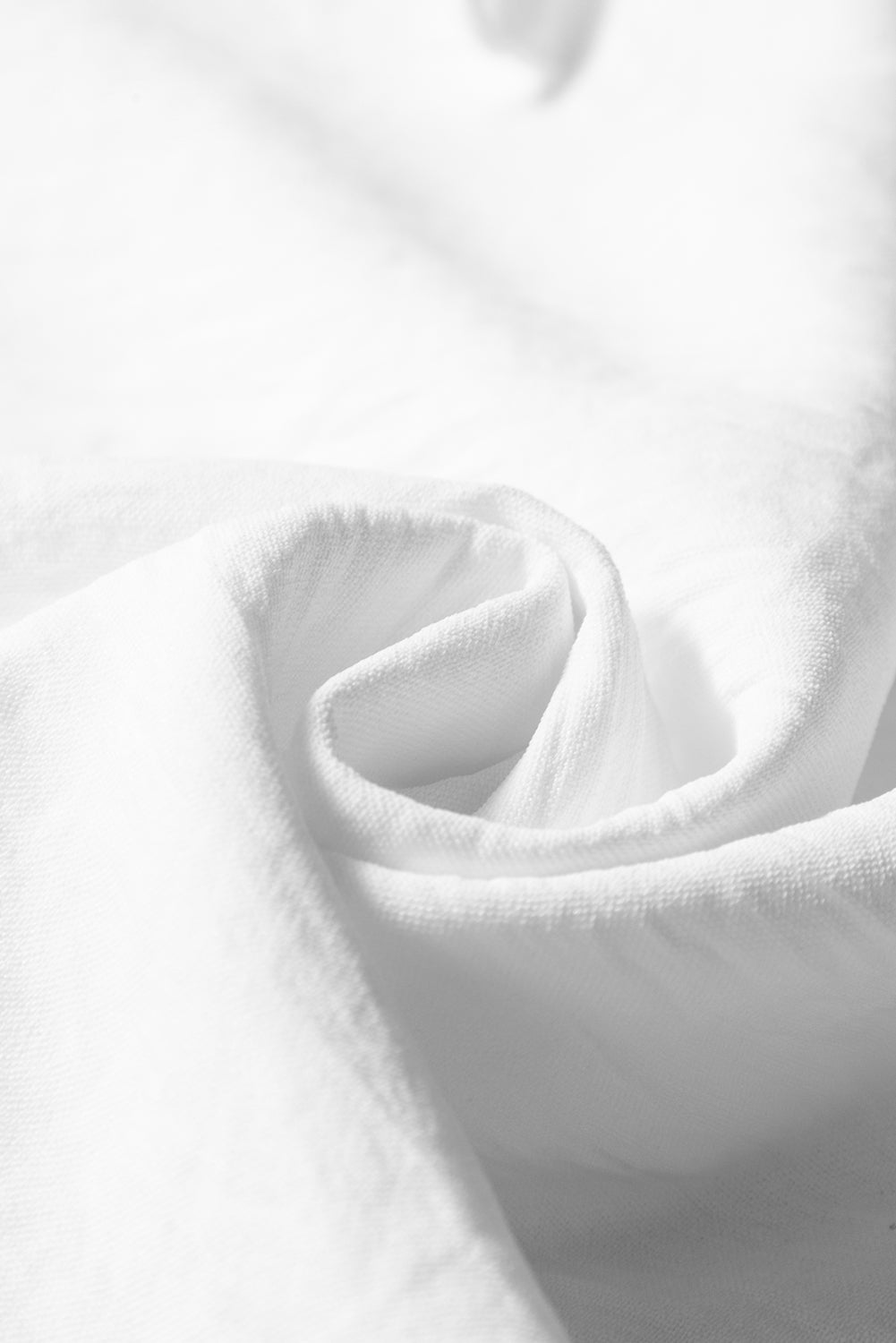 White textured blouse with embroidered ruffles *