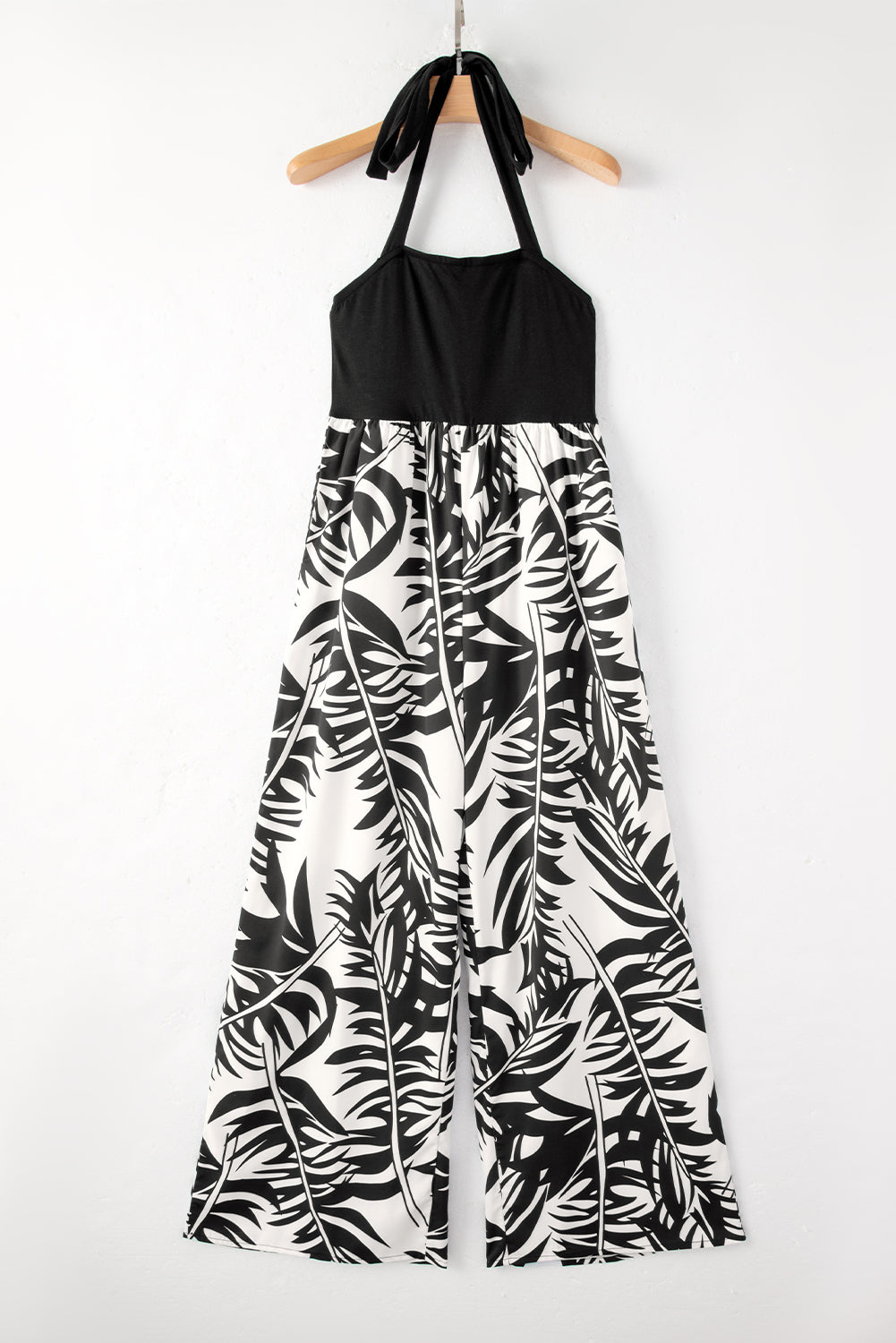 Black wide leg jumpsuit with tropical plant print