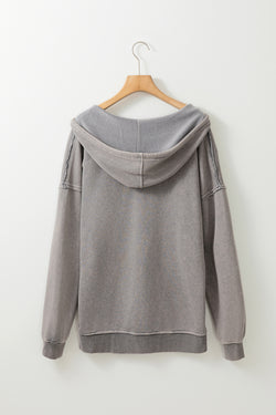 Grey mineral wash hoodie with exposed stitching