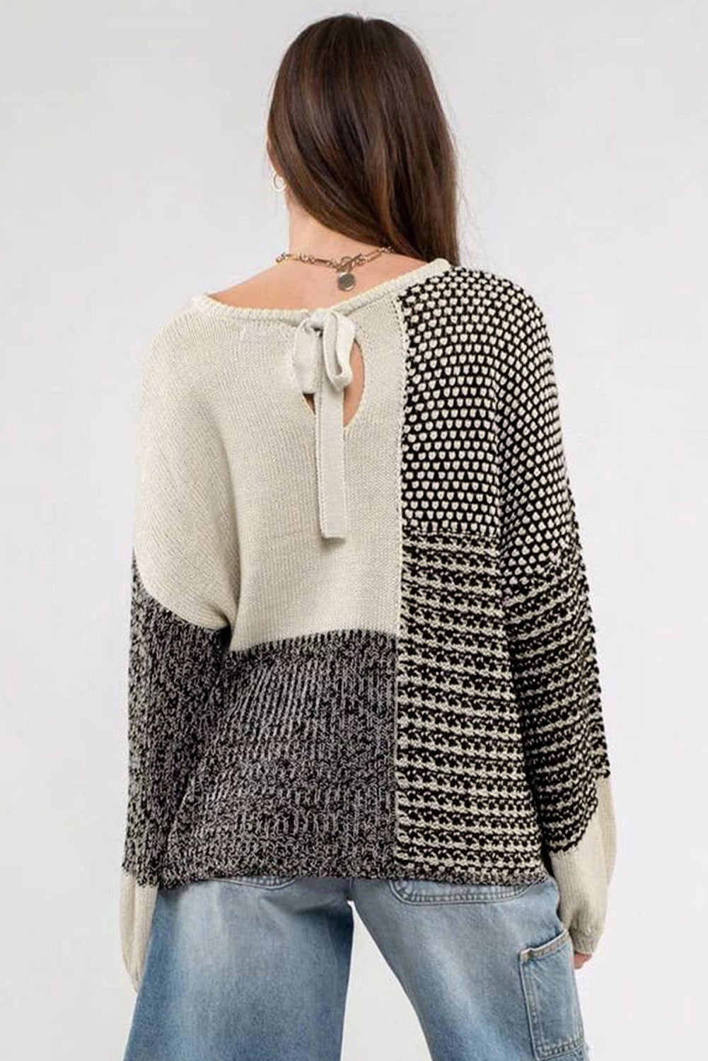 Neutral color block black sweater with tie at the back