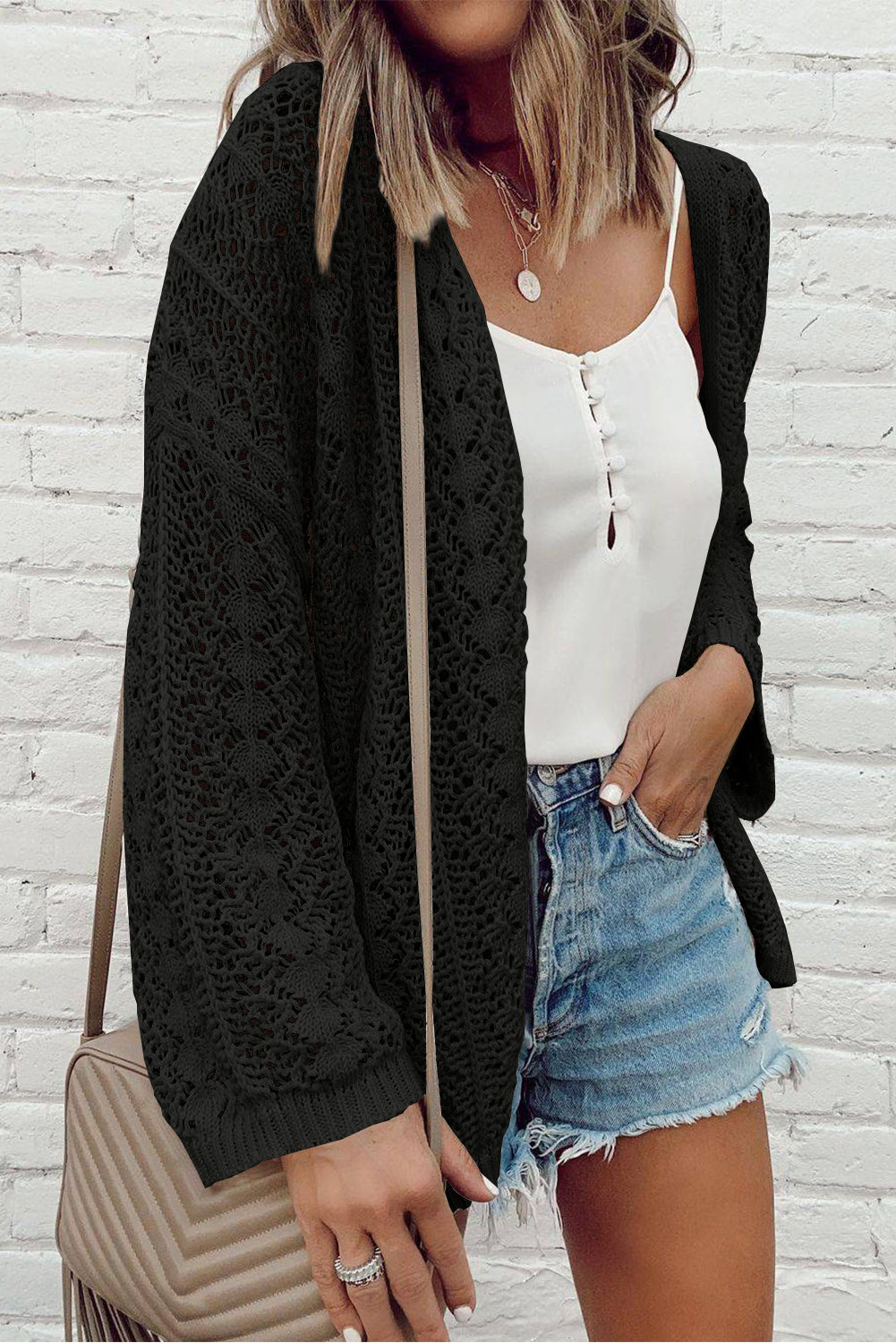 Black open front cardigan in openwork knit with dropped shoulders