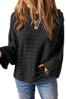 Dolman Pull in black ribbed knitting with exposed seams