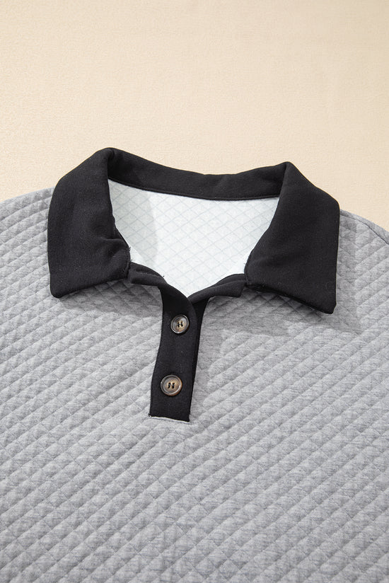 Light gray textured sweatshirt with color block edges and button-down collar