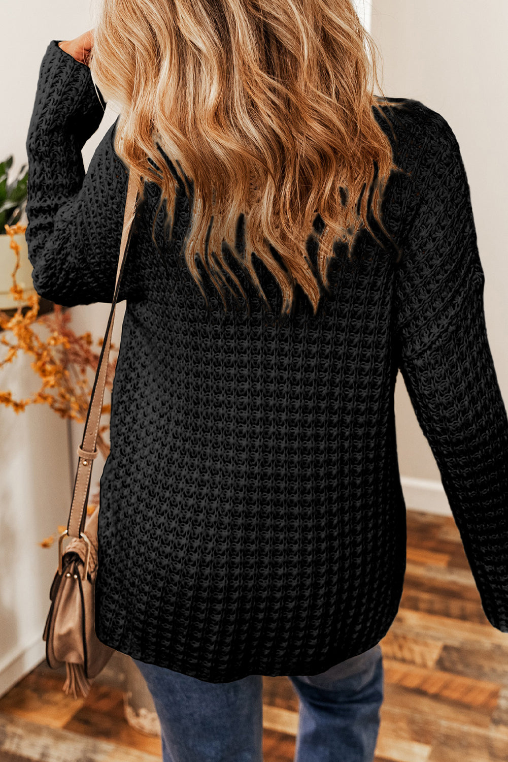 Black V-neck sweater with openwork crochet