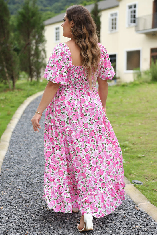 Smocked pink dress with puffy sleeves and large floral print