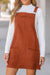 Sleeveless velvet overall dress with pockets before cinnamon units