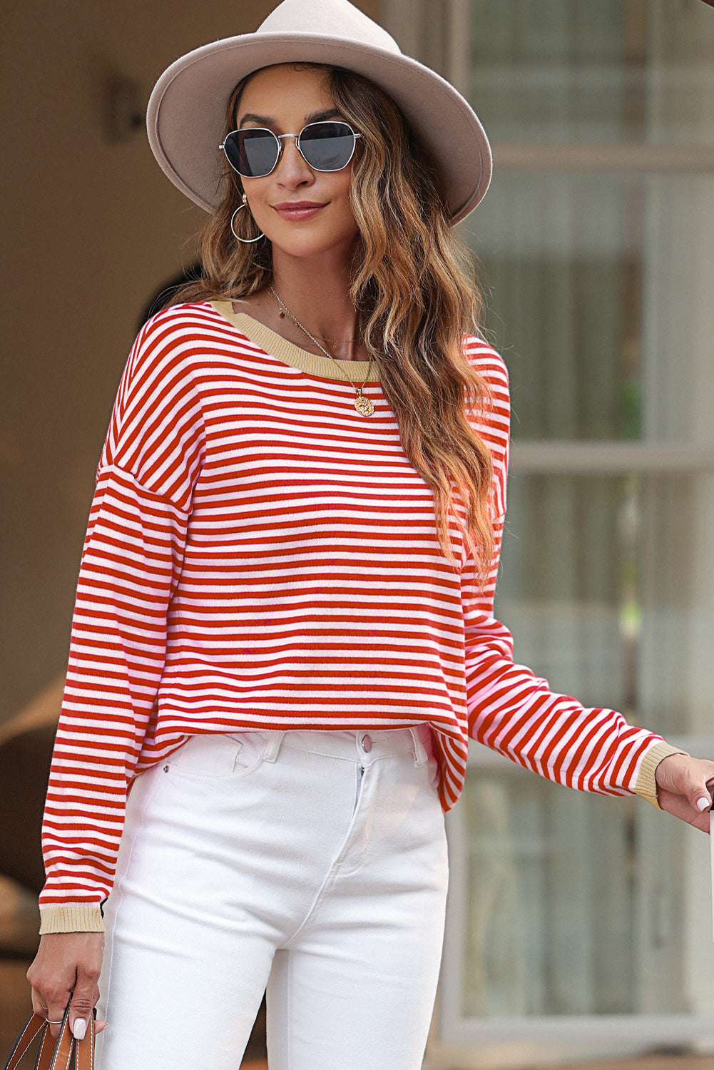 Striped drop shoulder sweater with bright red contrast trim