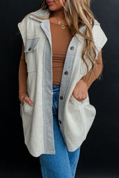 Light grey jacket with flap pockets and contrasting buttons on the front