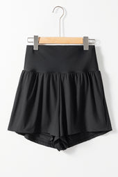 Black bath shorts with pockets and wide belt