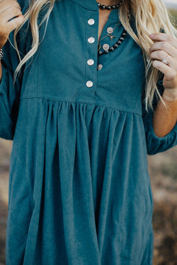 Blue sleeve dress and ribbed velvet bracelet with press pimples and empire waist