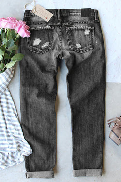 Gray aged effect jeans with buttoned pockets