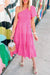 Asymmetrical midday dress with puffy sleeves and smocked bodice on several levels pink strawberry