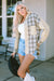 Khaki distressed denim jacket with plaid and patchwork with raw edges