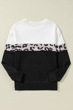 Black leopard top with long sleeves and a color block crew neck