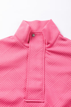 Hot pink textured sweatshirt with zip neck and kangaroo pocket