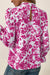 Pink blouse with floral print and ruffle sleeves with lock hole on the back