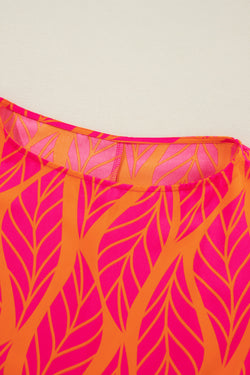 Smocked blouse with puffy sleeves and printed pink tropical leaves