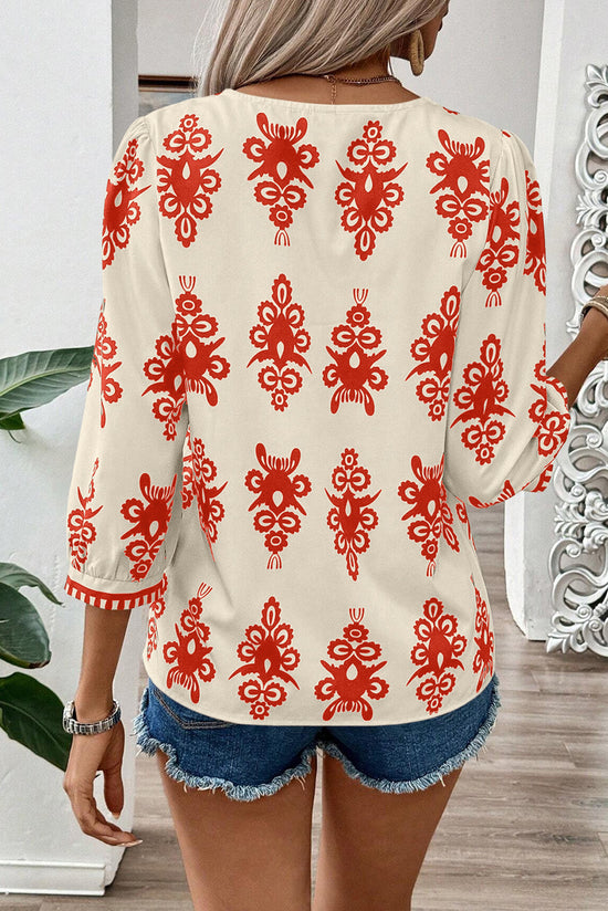 Orange blouse with geometric print*