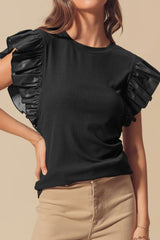Chemisier en cuir noir à manches volantées *-A WOMAN WE LOVE