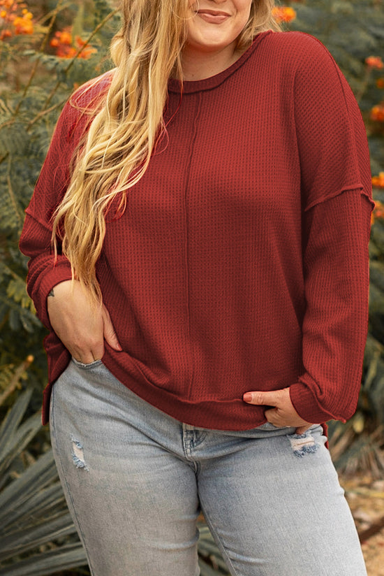 Plus size waffle knit top with exposed seams and gold flame