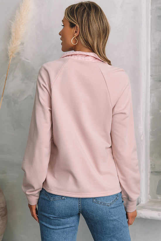 Pale chestnut textured sweatshirt with raglan sleeves and zipper on a quarter