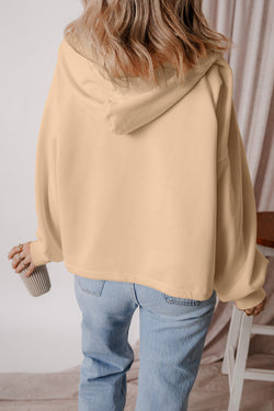 Loose-fitting half-zip hoodie with parchment fleece-lined kangaroo pockets