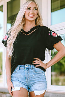 Black high with V -neck and puffy sleeves embroidered with flowers