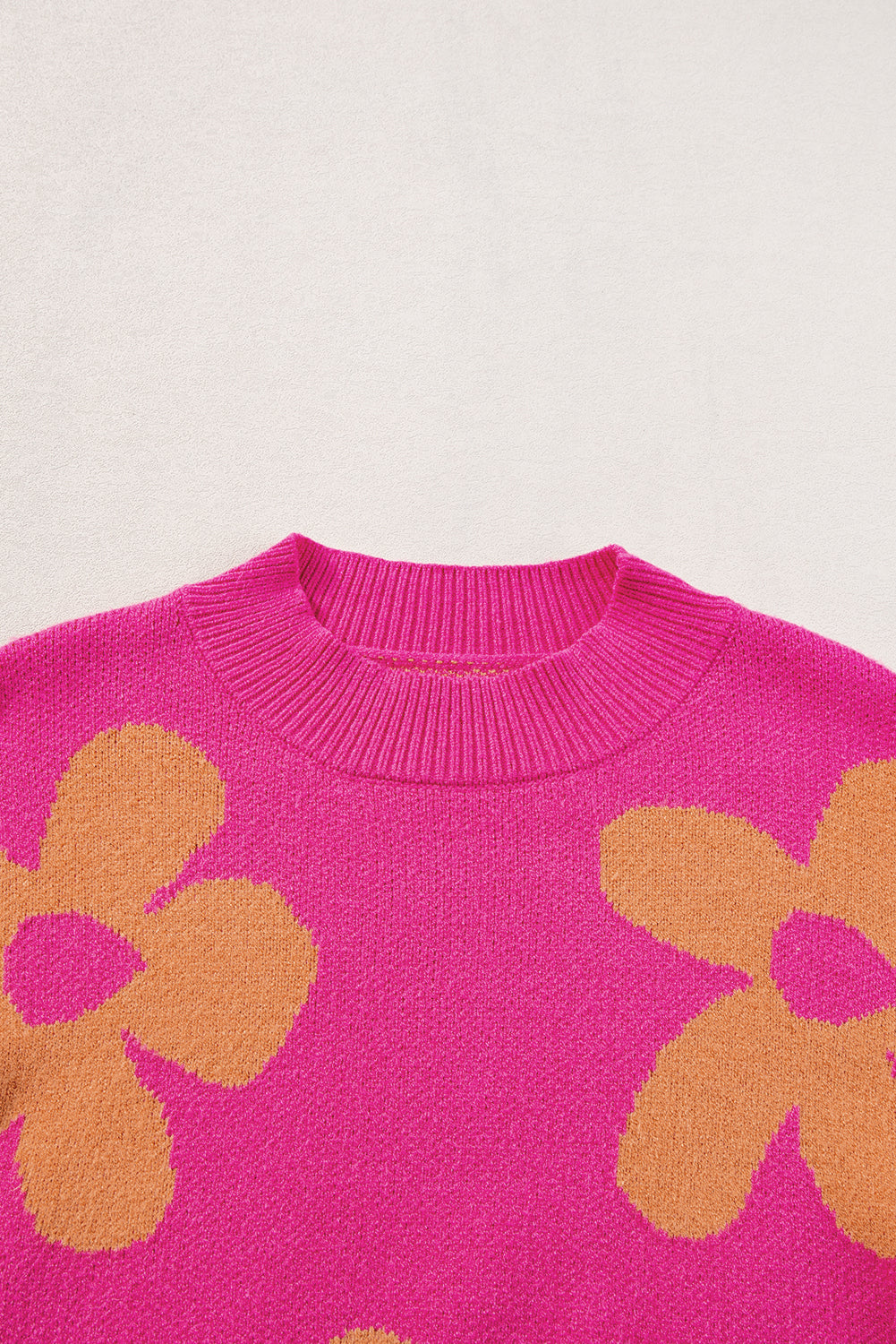 Long sleeve, high neck sweater with large pink flower pattern