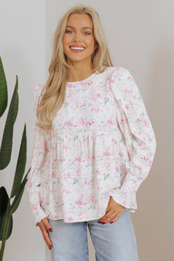 Babydoll pink blouse with floral print and frozen balloon sleeves with lock hole on the back