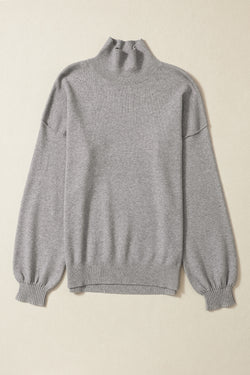 Grey turtleneck knit sweater with dropped shoulders and bubble sleeves