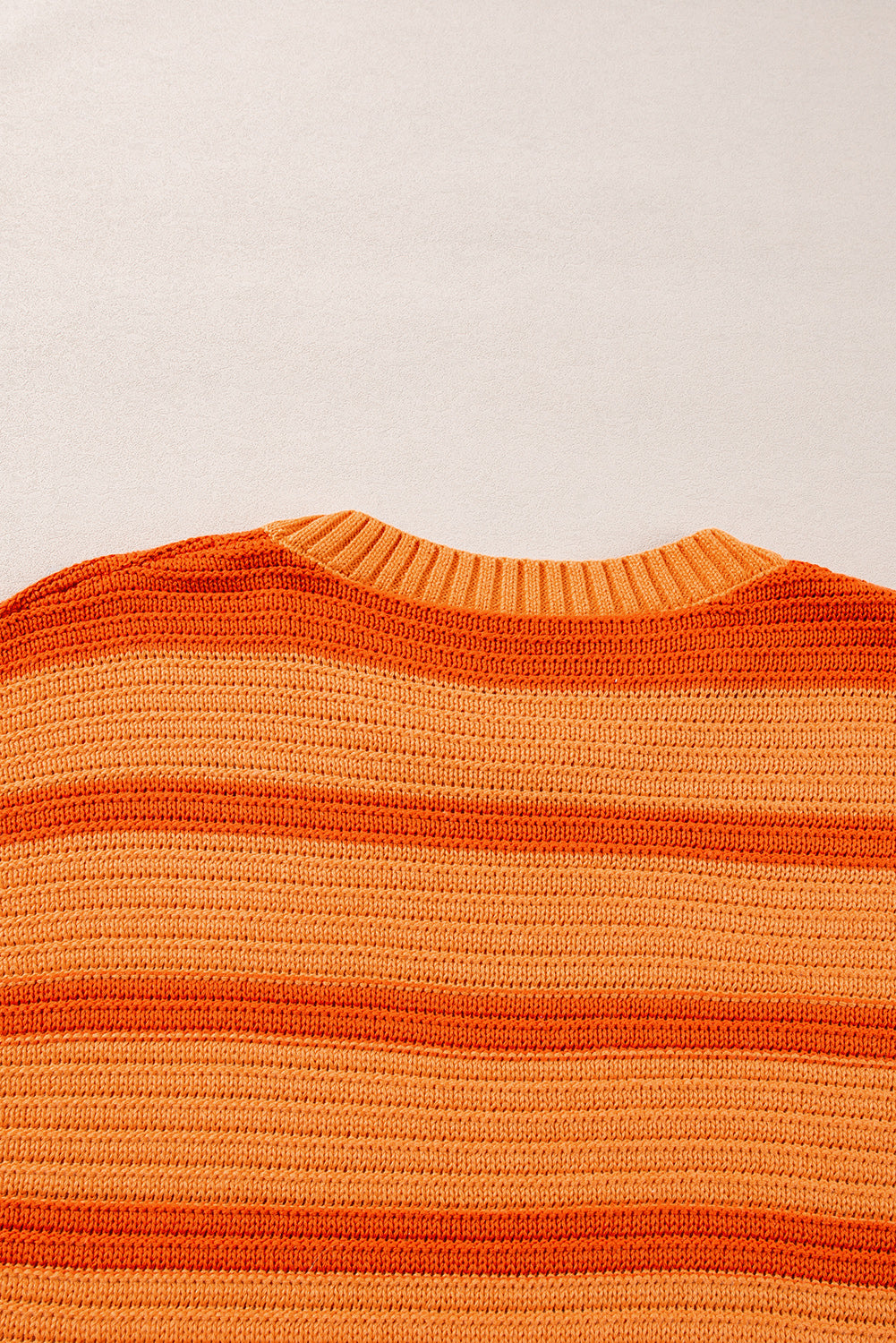 Loose sweater with orange stripes and color block, round neck, dropped shoulders