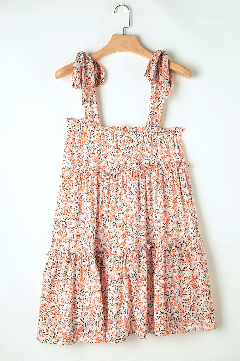 Tiered babydoll dress with knotted straps and orange pink flowers