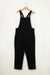 Black short jumpsuit with adjustable straps and buckle