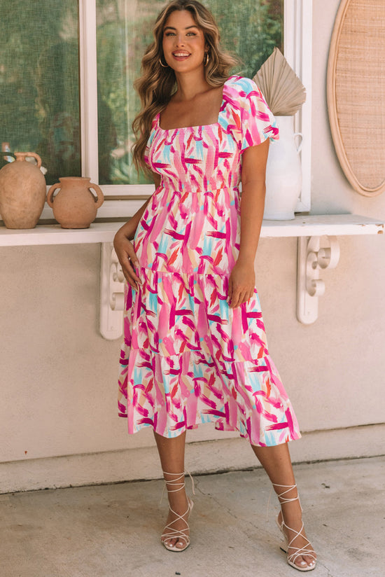 Vestido rosa smbilado con volantes y estampado de patada de pincel