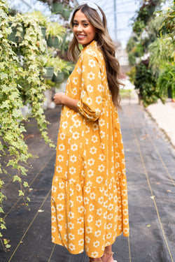 Vestido largo con collar y botones de manga pulsera y flores amarillas estampado