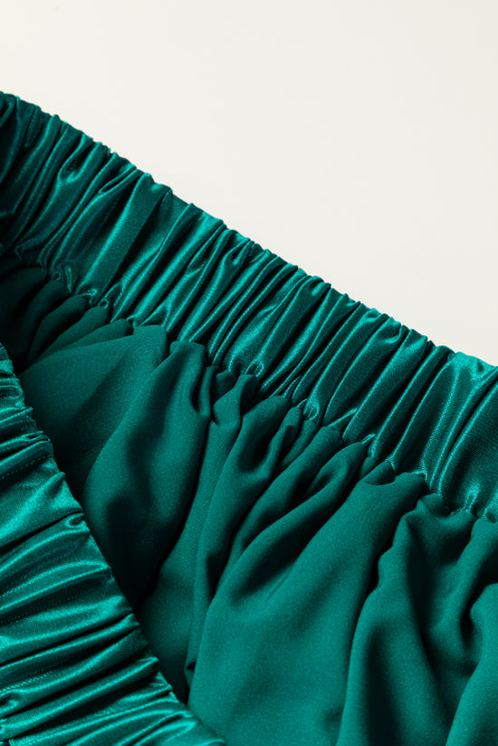 Jupe longue plissée en satin vert noirâtre à taille élastique