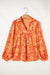 Babydoll orange blouse in V -collar and abstract print