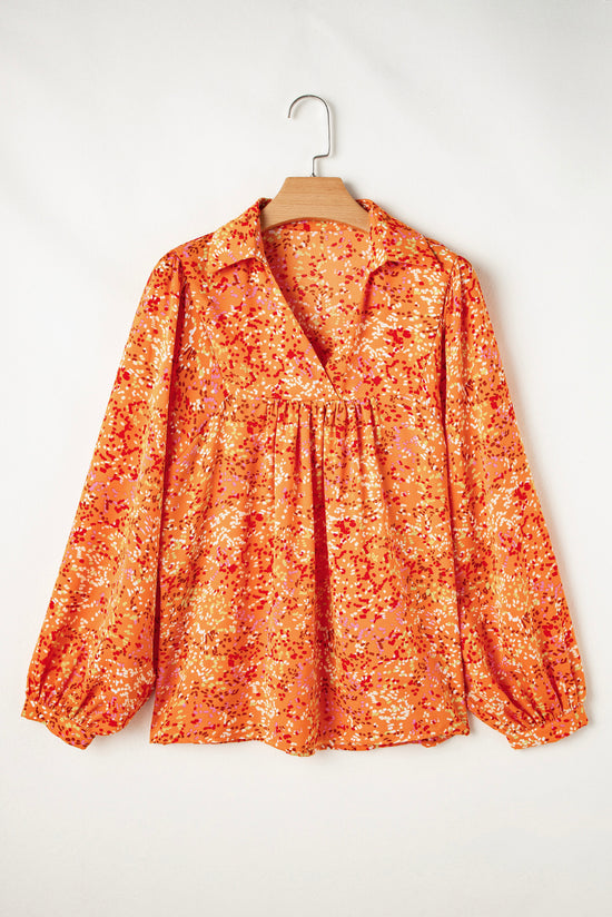 Babydoll orange blouse in V -collar and abstract print