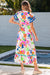 Long floral dress buttoned with floating sleeves and ricrac pink border