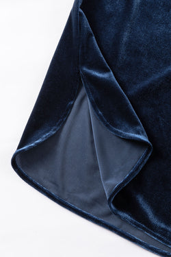 Navy blue velvet buttoned on the front at the flying collar