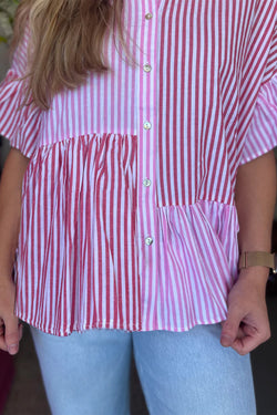 Shirt buttoned with pink stripes and ruffled hem in patchwork