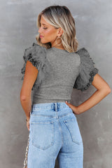 Gray ribbed knitting high with fluffy sleeves in polka dot mesh