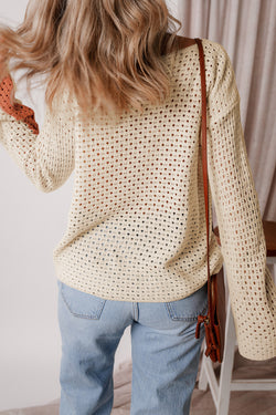 Loose fitting apricot color block pointelle knit sweater