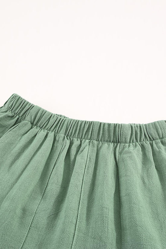 Pantalones cortos verdes con volantes y bolsillos de cintura alta